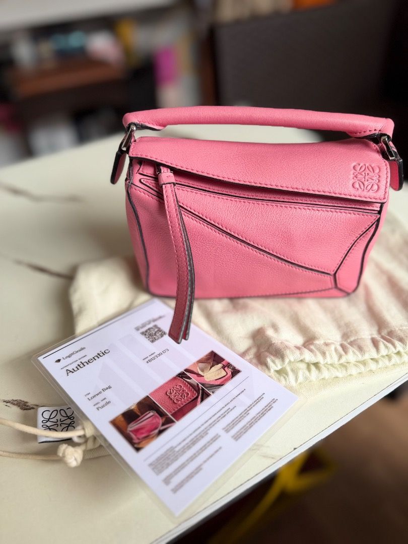 Loewe Puzzle Bag Pink Leather (Category: Luxury Bags & Wallets) located in Caloocan City. Submitted by piamariemo11606 (Listing ID 1463345398, Image 1). Description: - Authentic Loewe Puzzle bag - Lovely pink shade - Made from textured leather - Comes with dust bag - Includes authenticity card - Versatile for everyday or special occasions - Stylish addition to any outfit.