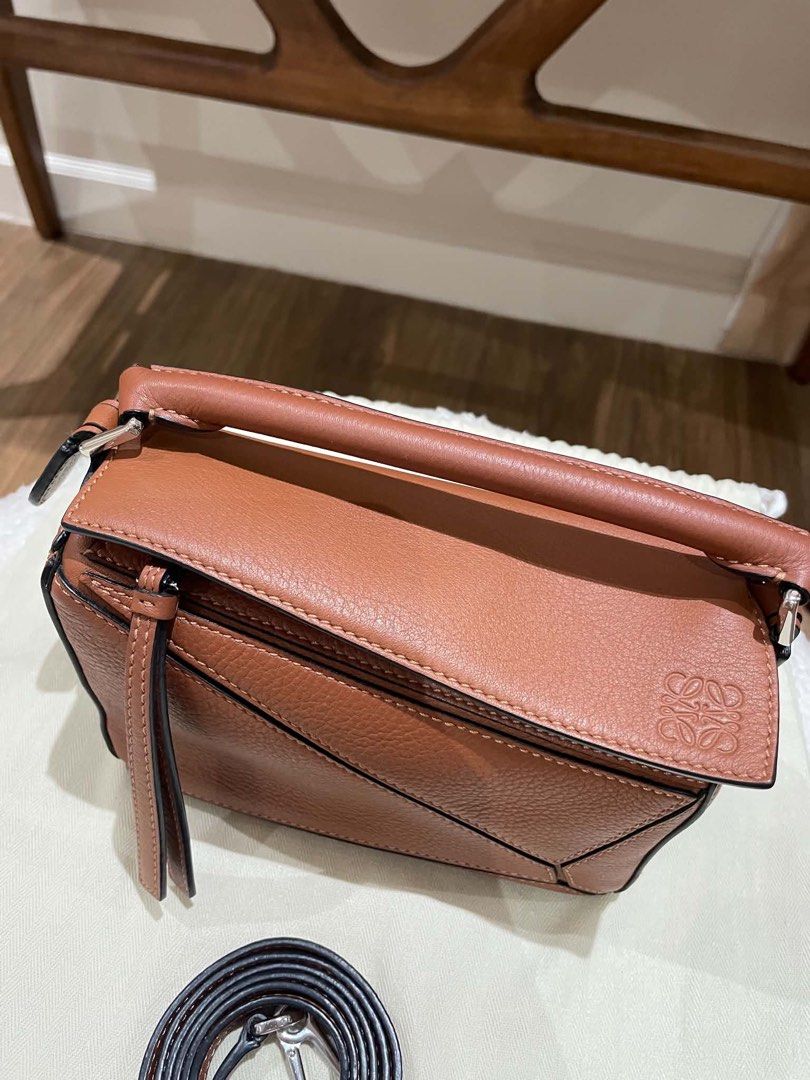 Loewe Puzzle Bag Small Tan Pebble Grain Leather (Category: Luxury Bags & Wallets) located in Davao. Submitted by camillefongty (Listing ID 1463402757, Image 3). Description: - Loewe Puzzle Bag - Color: Tan - Material: Pebble Grain Leather - Size: Small - Features: Detachable shoulder strap - Style: Classic, minimalist, chic - Versatile: Ideal for everyday or special occasions.