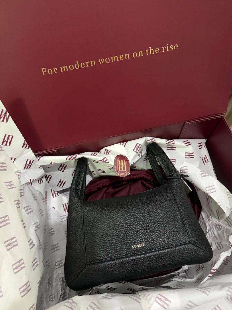 Lomafe Fien Regular Black Leather Handbag (Category: Shoulder Bags) located in Angat. Submitted by anjgalay (Listing ID 1463414548, Image 1). Description: - Brand: Lomafe - Material: Black Leather - Includes: Dust bag and original box - Special Feature: Original box has a motivational quote inside - Versatile: Suitable for everyday use or special occasions - Design: Minimalist USED TWICE ONLY.