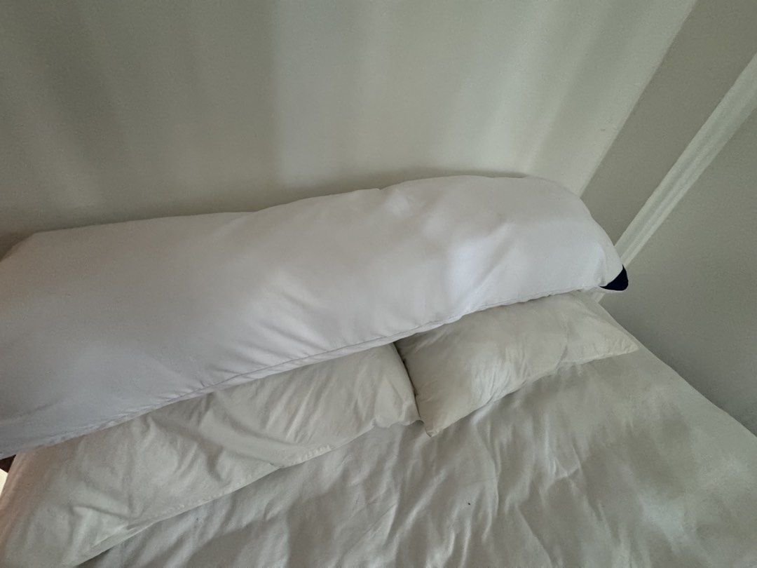 Long White Body Pillow (Category: Bedding & Towels) located in Manila. Submitted by decluterthings888 (Listing ID 1463336509, Image 1). Description: - Long white body pillow - Perfect for sleeping or lounging - Offers good support for back and legs - Adds extra comfort to your bed .