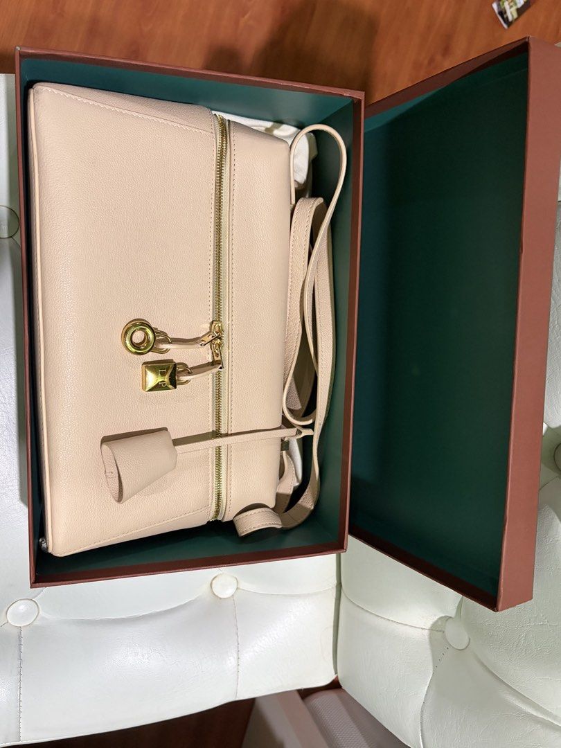 Loro Piana Vanity Case Bag Beige Leather (Category: Luxury Bags & Wallets) located in Las Pinas. Submitted by kulasa0725 (Listing ID 1463479773, Image 2). Description: - Brand: Loro Piana - Color: sun gold/ sunday morning - Material: smooth calfskin - Condition: lightly used - Includes: Original box and dust bag - Features: Gold hardware details, zip-around closure - Versatile use: Ideal for travel or everyday essentials.
