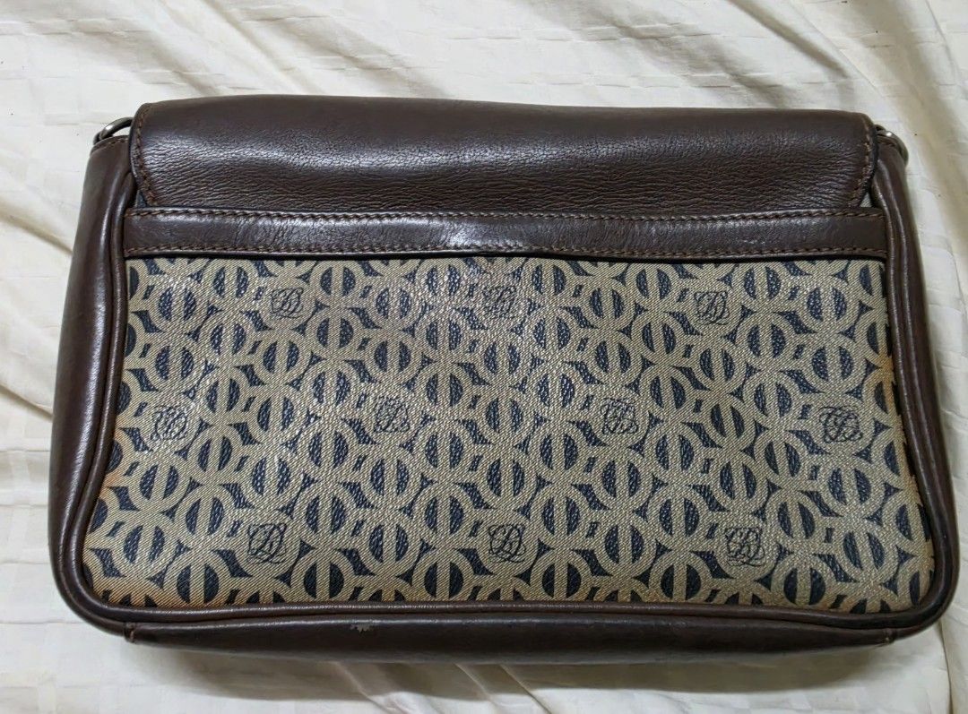 Louis Quatorze Brown Monogram Clutch Bag with Strap (Category: Luxury Bags & Wallets) located in Quezon City. Submitted by blackspider09 (Listing ID 1463479197, Image 2). Description: - Brown leather and monogram canvas clutch - Features Louis Quatorze logo pattern - Magnetic snap closure - Interior zip pocket - Detachable shoulder strap included - Perfect for evenings or travel - Note: Shows some signs of wear on the bottom edges negotiable.