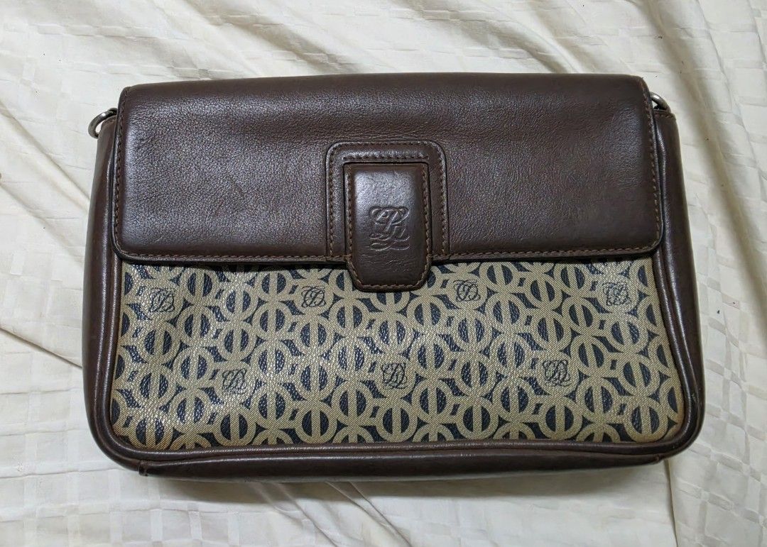 Louis Quatorze Brown Monogram Clutch Bag with Strap (Category: Luxury Bags & Wallets) located in Quezon City. Submitted by blackspider09 (Listing ID 1463479197, Image 1). Description: - Brown leather and monogram canvas clutch - Features Louis Quatorze logo pattern - Magnetic snap closure - Interior zip pocket - Detachable shoulder strap included - Perfect for evenings or travel - Note: Shows some signs of wear on the bottom edges negotiable.