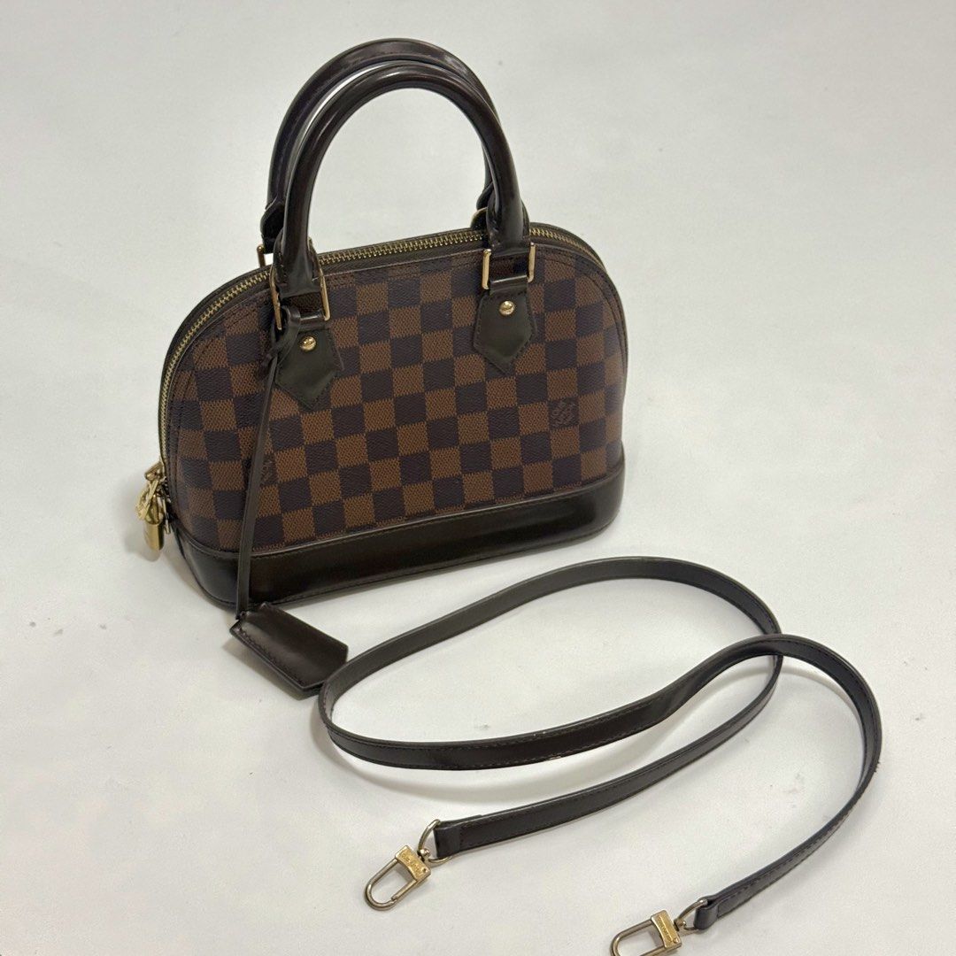 Louis Vuitton Alma BB (Category: Purses & Pouches) located in Pulilan. Submitted by secondary_chives (Listing ID 1463507120, Image 1). Description: in Excellent Condition Includes: long strap, clochette, two keys and padlock • Production Year: 2018 • Measurements: 9.5" L × 4.5" W × 7" H • Interior Pockets: One flat pocket • Handles: Double rolled leather handles and single flat detachable.