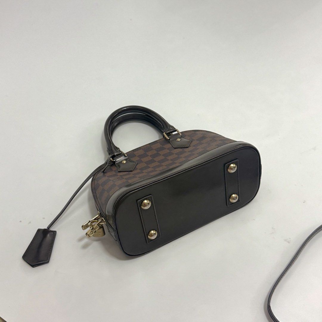 Louis Vuitton Alma BB (Category: Purses & Pouches) located in Pulilan. Submitted by secondary_chives (Listing ID 1463507120, Image 3). Description: in Excellent Condition Includes: long strap, clochette, two keys and padlock • Production Year: 2018 • Measurements: 9.5" L × 4.5" W × 7" H • Interior Pockets: One flat pocket • Handles: Double rolled leather handles and single flat detachable.