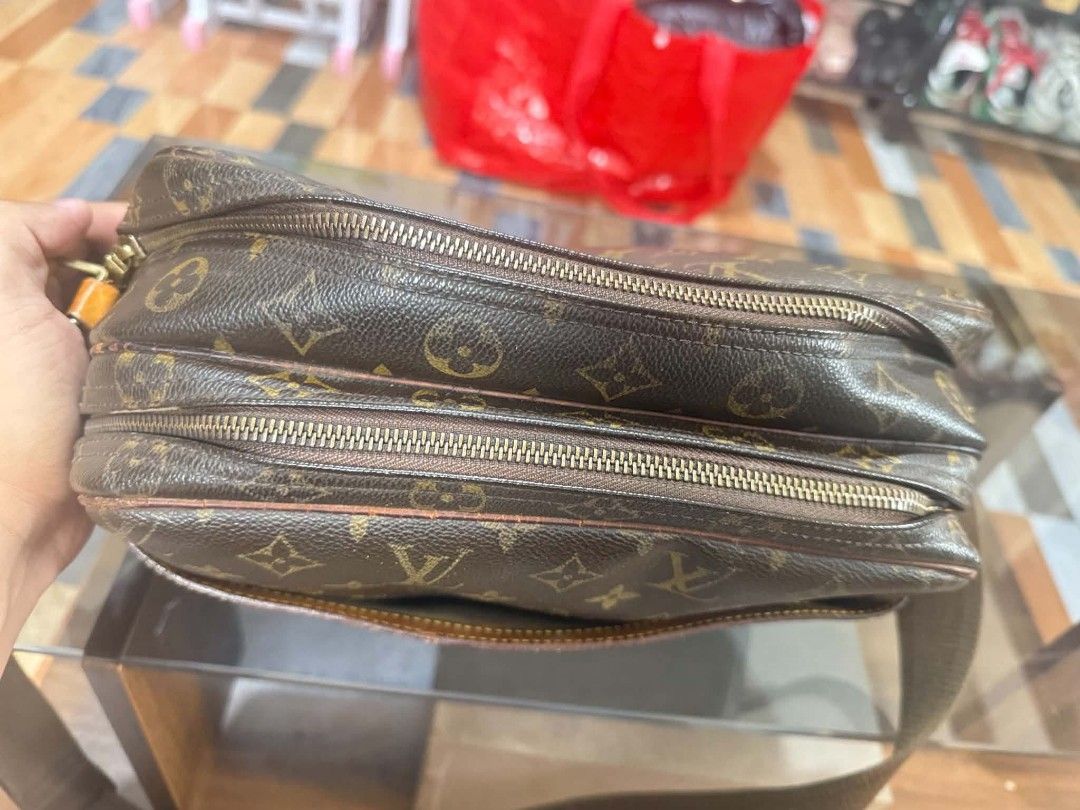 Louis Vuitton Monogram Canvas Crossbody Bag (Category: Luxury Bags & Wallets) located in Baguio. Submitted by solo_ukay (Listing ID 1463433236, Image 3). Description: - Authentic Louis Vuitton crossbody bag - Classic monogram canvas - Multiple zippered compartments for organization - Adjustable strap for comfortable wear - Leather trim shows some patina - Zippers are functional - Great everyday bag.