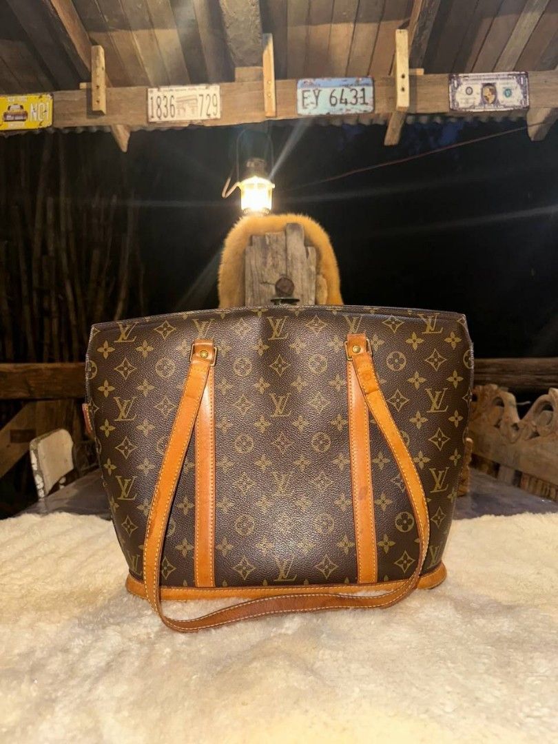 Louis Vuitton Monogram Canvas Babylone Tote Bag (Category: Luxury Bags & Wallets) located in Dagupan City. Submitted by finestthriftstuffph (Listing ID 1463452496, Image 2). Description: (Authentic) Made USA In Very Good Condition Condition: Excellent Color Rate: 9.8/10 Issue: None "Colors may vary due to lightning" "Swipe each photo to see more details".