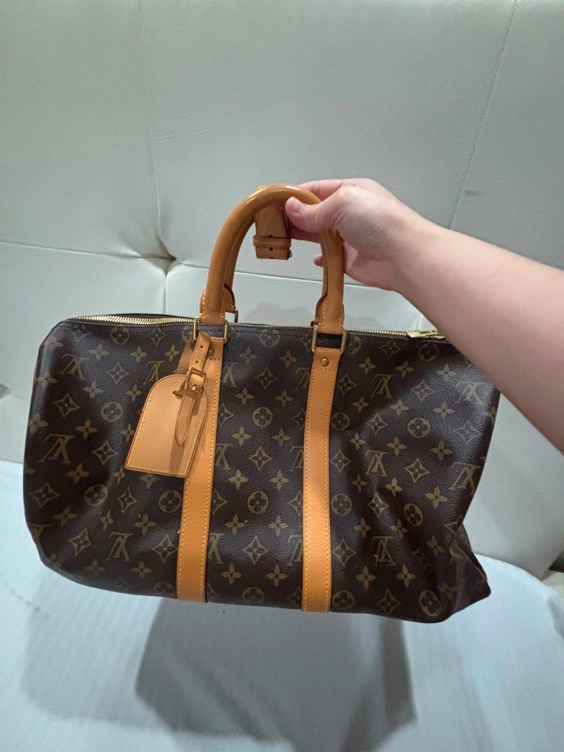 Louis Vuitton Monogram Keepall 45 (Category: Luxury Bags & Wallets) located in Manila. Submitted by beahart (Listing ID 1463518374, Image 2). Description: Authentic Louis Vuitton Keepall 45 Monogram | Barely Used | Excellent Condition Authentic Louis Vuitton Keepall 45 Monogram Barely used and kept in excellent condition. Classic LV Monogram canvas with natural vachetta leather trim and gold-tone hardware. * Size: Keepall 45 * Spacious interior, 