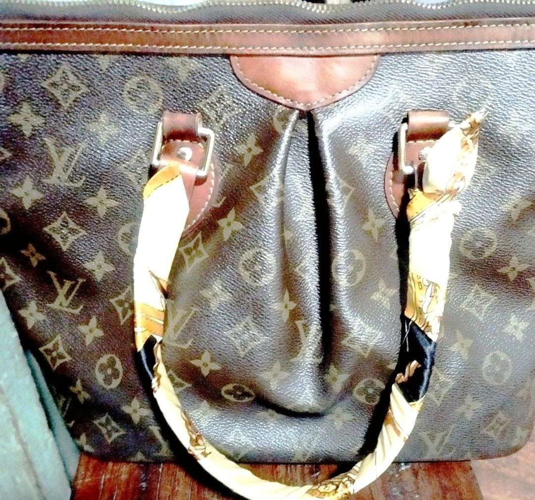 Louis Vuitton Monogram palermoBag with Scarf (Category: Tote Bags) located in Manila. Submitted by lene48 (Listing ID 1463373199, Image 2). Description: - Classic Louis Vuitton Speedy bag - Monogram canvas with leather trim - Handles adorned with a cute scarf - Secure zipper closure with iconic LV charm - Ideal everyday bag with generous interior space.