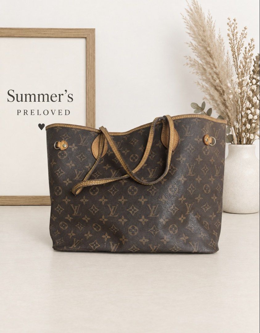 Louis Vuitton Neverfull (Category: Tote Bags) located in Taguig. Submitted by summers.preloved (Listing ID 1463513043, Image 1). Description: Bag Details 🤎 Exterior: Brown Monogram coated canvas with Elvira initials and floral motifs 🍯 Trim and handles: Tan leather with visible darkening and an aged patina 🧵 Design: Open-top tote with a broad rectangular base and a flexible body 👜 Carry style: Two slim handles for shoulder or forearm carry 🔒