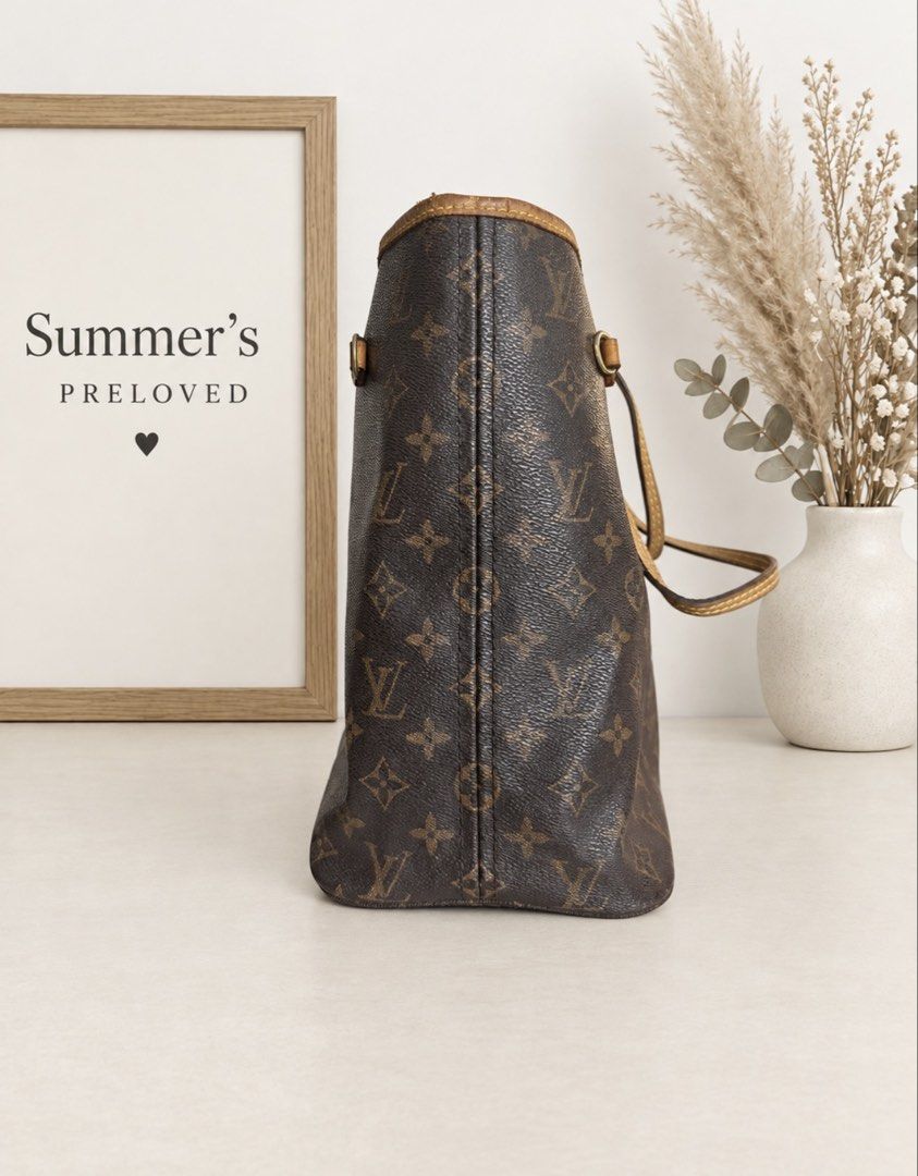Louis Vuitton Neverfull (Category: Tote Bags) located in Taguig. Submitted by summers.preloved (Listing ID 1463513043, Image 3). Description: Bag Details 🤎 Exterior: Brown Monogram coated canvas with Elvira initials and floral motifs 🍯 Trim and handles: Tan leather with visible darkening and an aged patina 🧵 Design: Open-top tote with a broad rectangular base and a flexible body 👜 Carry style: Two slim handles for shoulder or forearm carry 🔒
