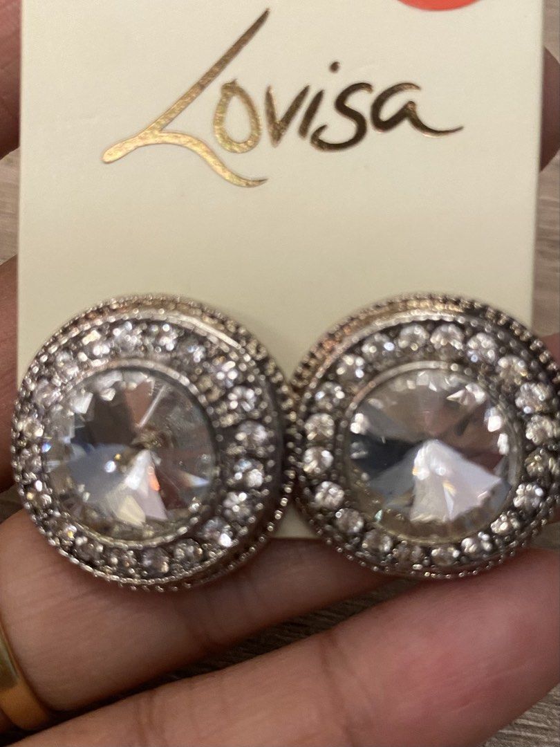 Lovisa Silver Stud Earrings with Clear Gems (Category: Earrings) located in Santa Rosa. Submitted by hoardqueensdeclutter (Listing ID 1463342855, Image 1). Description: - Sparkly Lovisa stud earrings - Silver-tone finish - Large clear gem center surrounded by smaller gems - Comes on original Lovisa card - Originally purchased in Australia for $9.99 AUD.