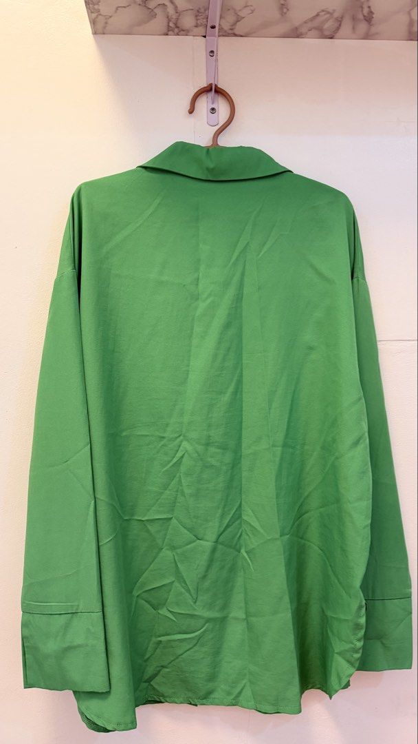 Lovito Green Oversized Button-Up Shirt (Category: Shirts) located in Angeles City. Submitted by hooni_park (Listing ID 1463481066, Image 2). Description: - Lovito green button-up shirt - Oversized fit, long sleeves - Estimated size: Medium - Ideal for casual outfits or layering - Classic and versatile design.