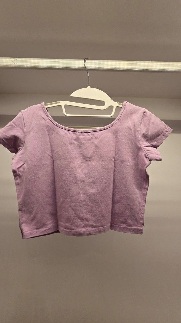 Lovito Lilac Button Up Cropped Top (Category: Blouses) located in Mandaluyong City. Submitted by loijiminigo (Listing ID 1463457926, Image 2). Description: - Lovito lilac cropped top - Short sleeves - Button-up front - Soft and comfortable fabric - Versatile for casual or dressed-up outfits - Easy to pair with jeans or skirts.