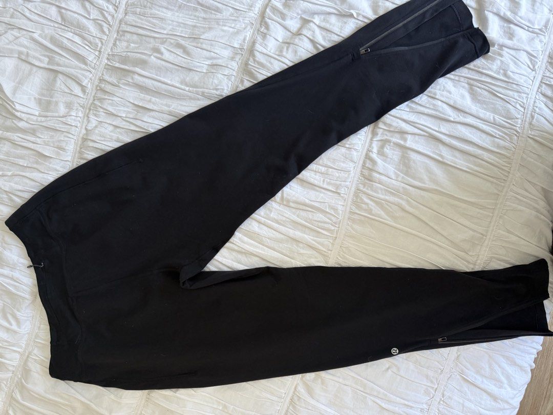 Lululemon Black Athletic Pants with Zippers (Category: Activewear) located in Makati City. Submitted by imtheseller001 (Listing ID 1463371811, Image 1). Description: - Black Lululemon athletic pants - Zippered ankles for adjustable fit - Lululemon logo on the leg - Drawstring waist with red accents - Comfortable and versatile for workouts or casual wear.