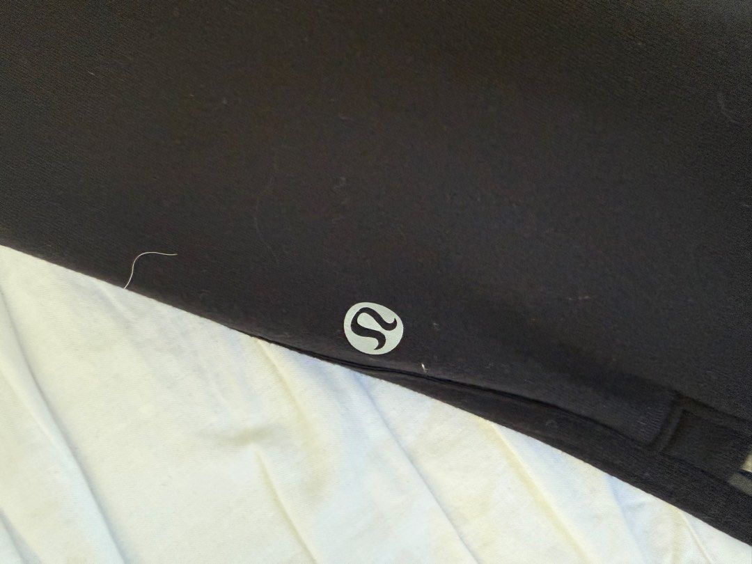 Lululemon Black Athletic Pants with Zippers (Category: Activewear) located in Makati City. Submitted by imtheseller001 (Listing ID 1463371811, Image 2). Description: - Black Lululemon athletic pants - Zippered ankles for adjustable fit - Lululemon logo on the leg - Drawstring waist with red accents - Comfortable and versatile for workouts or casual wear.