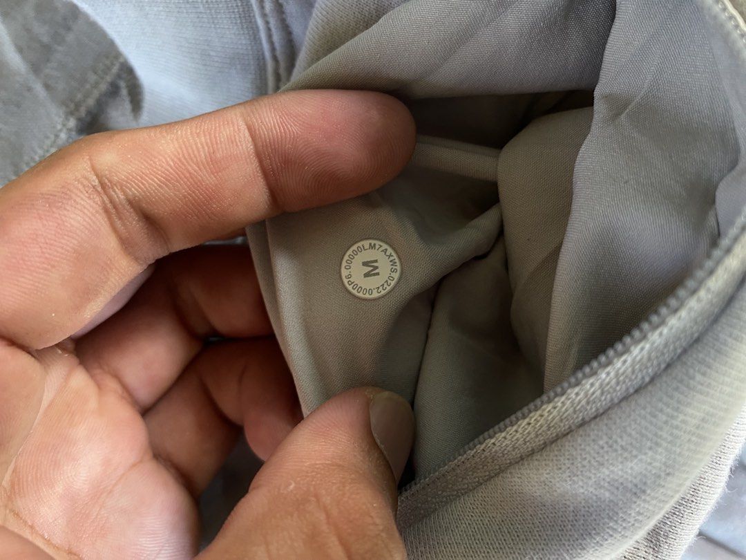 Lululemon Grey Athletic Shorts Size M (Category: Shorts) located in Sinait. Submitted by rinzuthrift (Listing ID 1463554005, Image 3). Description: - Grey Lululemon shorts - Size M - Elastic waistband with drawstring - Side and back pockets - Ideal for workouts and lounging.