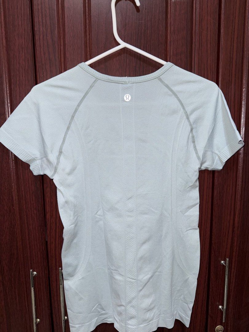 Lululemon Swiftly Tech Short Sleeve Shirt (Category: Activewear) located in Bulacan. Submitted by aubreyangelieee (Listing ID 1463440625, Image 2). Description: - Light blue Lululemon t-shirt - Lululemon swiftly tech crewneck short-sleeve - Short sleeves and crew neck - Breathable and seamless fabric - Ideal for workouts or everyday wear - Lululemon logo detail on back and sleeve - Cut tags - Has small stains.