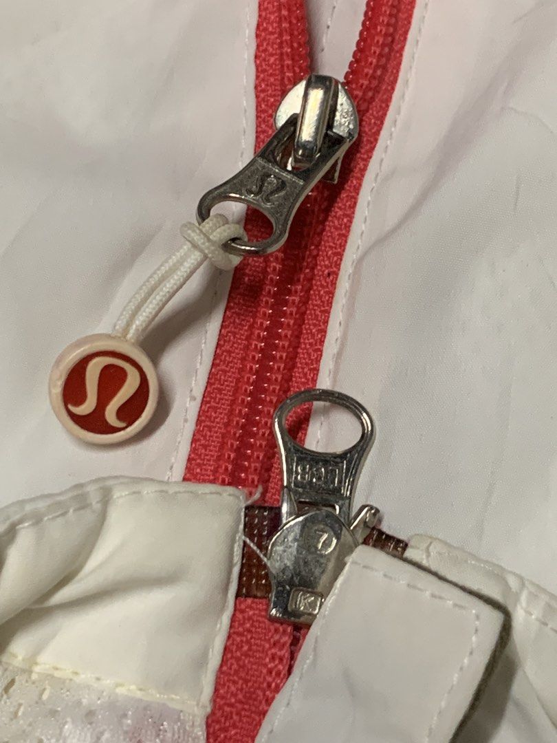 Lululemon White & Olive Green Athletic Jacket (Category: Coats, Jackets and Outerwear) located in Cavite. Submitted by good.garments (Listing ID 1463330812, Image 1). Description: - White Lululemon athletic jacket - Olive green accent details - Full zip front with red zipper pull - Reflective grey stripes on sleeves and back - Zippered pocket on the back - Ideal for workouts and casual wear.