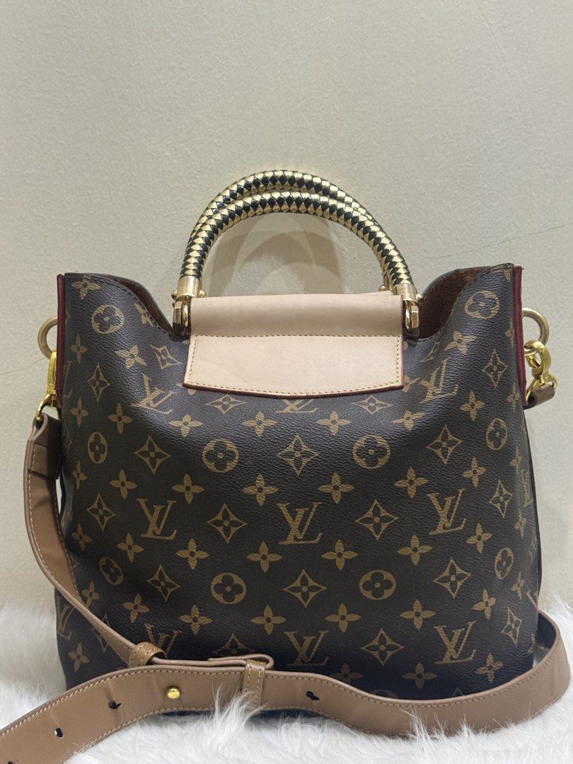 Louis Vuitton Monogram Canvas Beaubourg Hobo MM (Category: Cross-body Bags) located in Quezon City. Submitted by clazzystudio (Listing ID 1463351754, Image 3). Description: Selling this chic and stylish Louis Vuitton Beaubourg Hobo shoulder bag crafted in iconic Monogram coated canvas with a distinctive hand-braided top handle. Features a supple, structured slouchy body, light tan leather trim with debossed "Louis Vuitton Paris" detailing, double