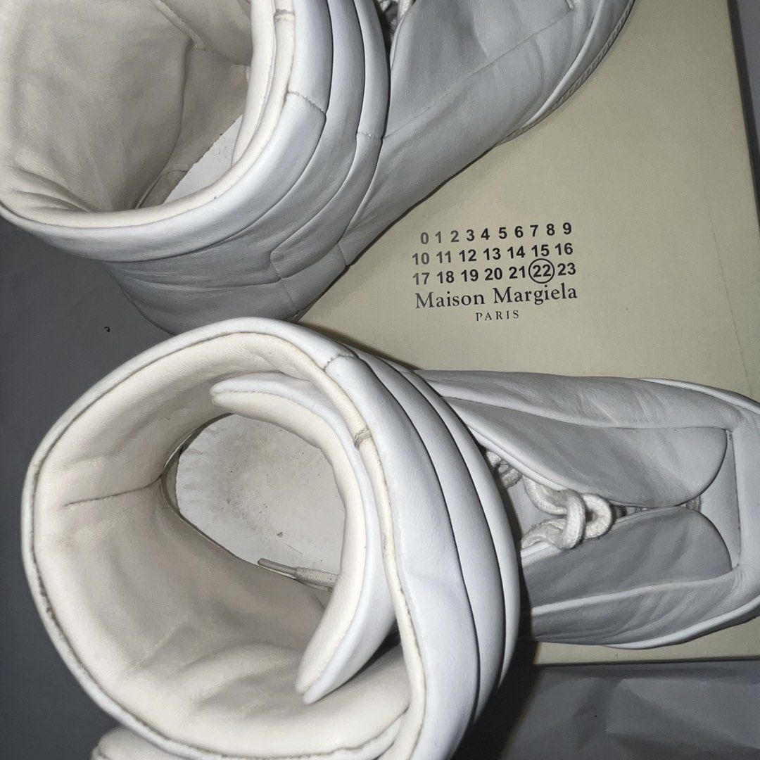 (offers open) Maison Margiela - Future Sneakers Size 40 (Category: Dress Shoes) located in Taguig. Submitted by buytrysellrepeat (Listing ID 1463382252, Image 2). Description: - Maison Margiela Replica High-Top Sneakers - Color: White - Size: 40 - Material: Leather - Origin: Made in Italy - Includes: Original box - Style: Iconic, fashion-forward statement piece.