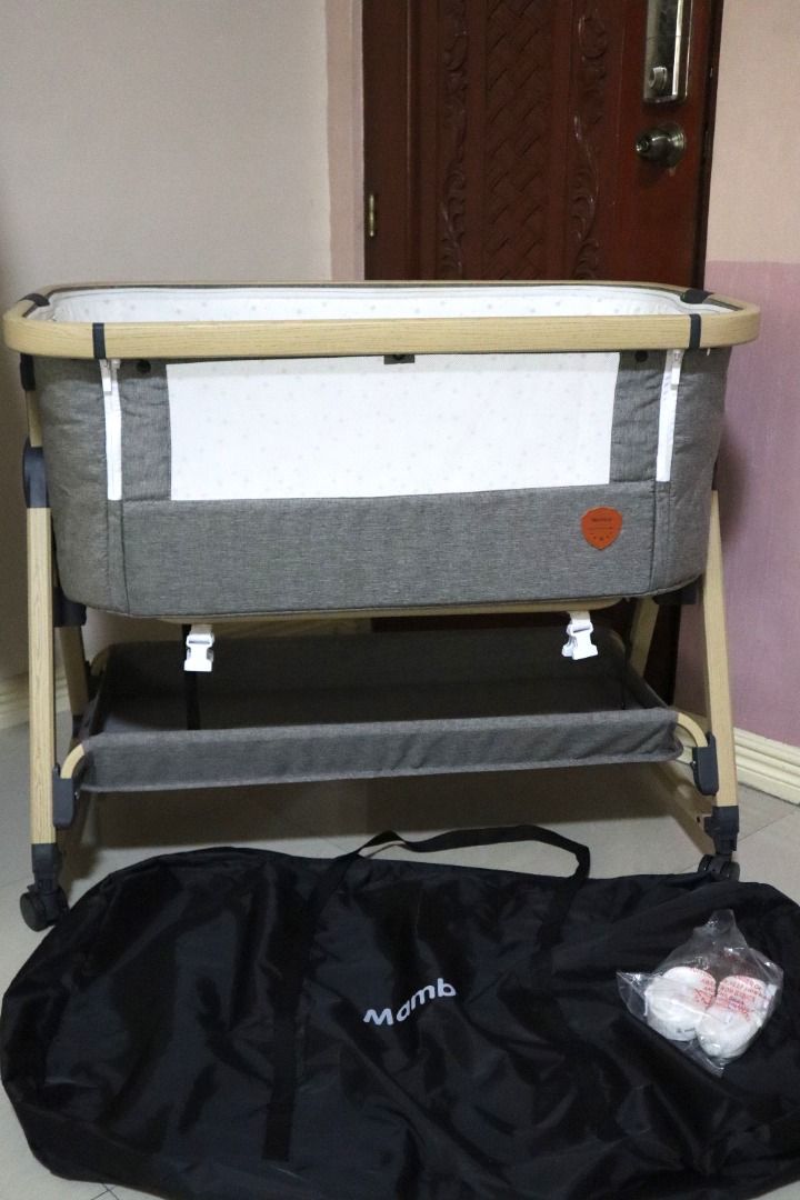 Mambo Co-Sleeper Crib (Category: Cots & Cribs) located in Malolos. Submitted by oneflightdown (Listing ID 1463412630, Image 2). Description: Mambo Co-Sleeper Crib The Mambo Co-Sleeper Crib with Rocker is designed to provide comfort and convenience for both baby and parents. This versatile crib can be converted into a bedside sleeper by unlatching the sidebar, making nighttime feedings easier for breastfeeding moms. It also functions as a gentle b