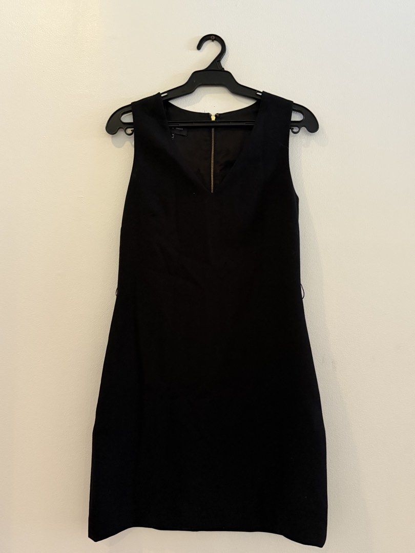 Mango Basics Black Sleeveless V-Neck Dress (Category: Dresses) located in Makati City. Submitted by jcalmartz (Listing ID 1463331257, Image 1). Description: - Black sleeveless dress from Mango Basics - V-neckline with a gold zipper detail at the front - Simple and classic design - Great for dressing up or down - Made in Vietnam.
