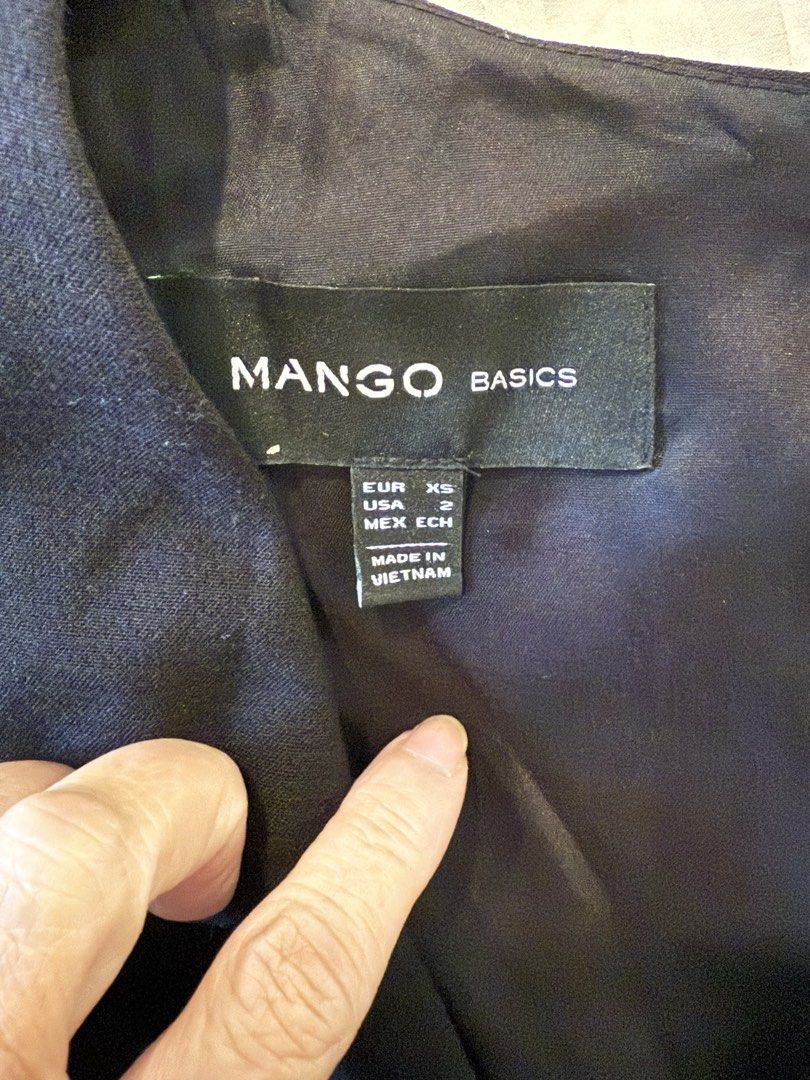 Mango Basics Black Sleeveless V-Neck Dress (Category: Dresses) located in Makati City. Submitted by jcalmartz (Listing ID 1463331257, Image 2). Description: - Black sleeveless dress from Mango Basics - V-neckline with a gold zipper detail at the front - Simple and classic design - Great for dressing up or down - Made in Vietnam.