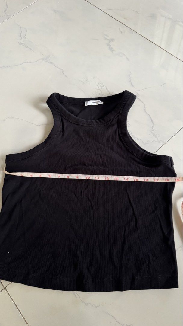 Mango Black Ribbed Racerback Tank Top (Category: Sleeveless) located in Manila. Submitted by patc20 (Listing ID 1463368883, Image 3). Description: - Brand: MNG - Style: Black ribbed racerback tank top - Material: Stretchy - Measurements: Approx. 18" chest, 20" length - Features: Racerback design, great basic piece - Styling: Easy to pair with jeans or skirts.