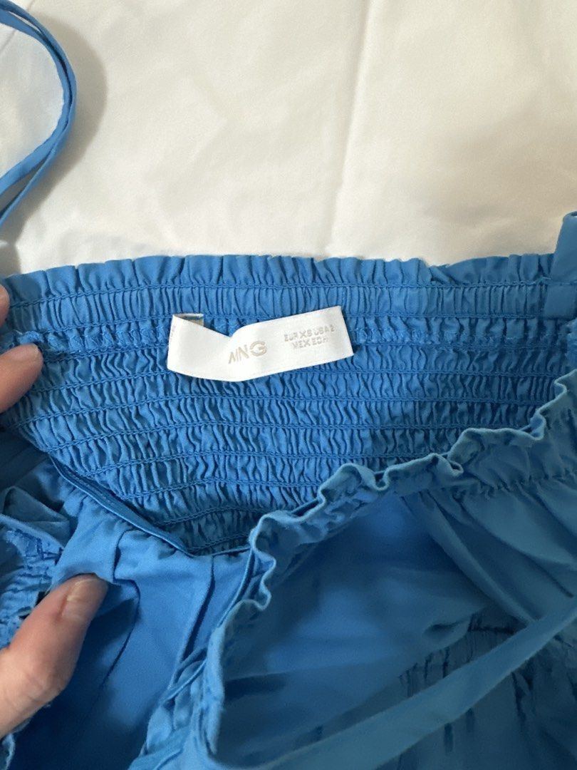 Mango Blue Smocked Maxi Dress (Category: Dresses) located in Manila. Submitted by joan.here (Listing ID 1463407667, Image 3). Description: Brand: mango Size: xs Condition: used but not abused. Actual color not as bright as shown in photo Mop: bank transfer Delivery: grab/ lalamove. Sf shouldered by buyer Loc: tondo manila.