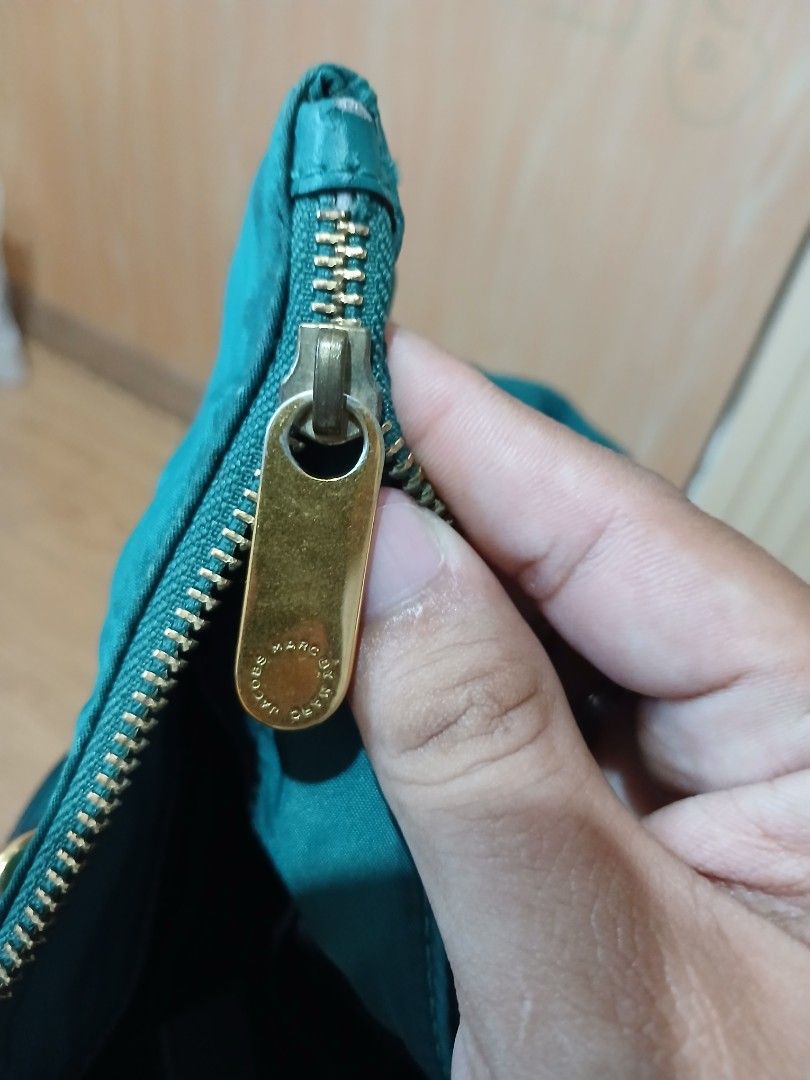Marc by Marc Jacobs Nylon Tote Bag Teal (Category: Luxury Bags & Wallets) located in Daraga. Submitted by thethriftcity2024 (Listing ID 1463401504, Image 1). Description: - Brand: Marc by Marc Jacobs - Color: Teal - Material: Nylon with leather handles and trim - Closure: Zipper - Interior: 1 zipped pocket, 1 slip pocket - Origin: Made in the Philippines - Ideal for: Everyday use.