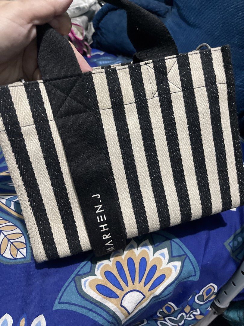 Marhen.J Striped Tote Bag & Black Drawstring Bag (Category: Tote Bags) located in Manila. Submitted by edensy (Listing ID 1463551950, Image 3). Description: - Marhen.J tote bag with stylish black and white stripes - Features a small, authentic brand name tag - Includes a versatile black drawstring bucket bag stripe lost strap but can use as alternate the other sling bag same brand same color - Both bags are ideal for everyday use.