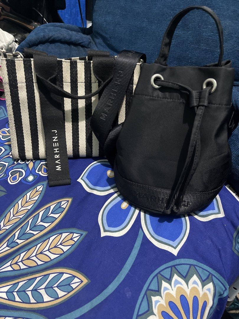 Marhen.J Striped Tote Bag & Black Drawstring Bag (Category: Tote Bags) located in Manila. Submitted by edensy (Listing ID 1463551950, Image 1). Description: - Marhen.J tote bag with stylish black and white stripes - Features a small, authentic brand name tag - Includes a versatile black drawstring bucket bag stripe lost strap but can use as alternate the other sling bag same brand same color - Both bags are ideal for everyday use.