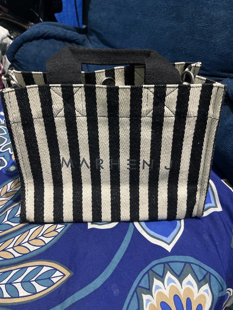 Marhen.J Striped Tote Bag & Black Drawstring Bag (Category: Tote Bags) located in Manila. Submitted by edensy (Listing ID 1463551950, Image 2). Description: - Marhen.J tote bag with stylish black and white stripes - Features a small, authentic brand name tag - Includes a versatile black drawstring bucket bag stripe lost strap but can use as alternate the other sling bag same brand same color - Both bags are ideal for everyday use.