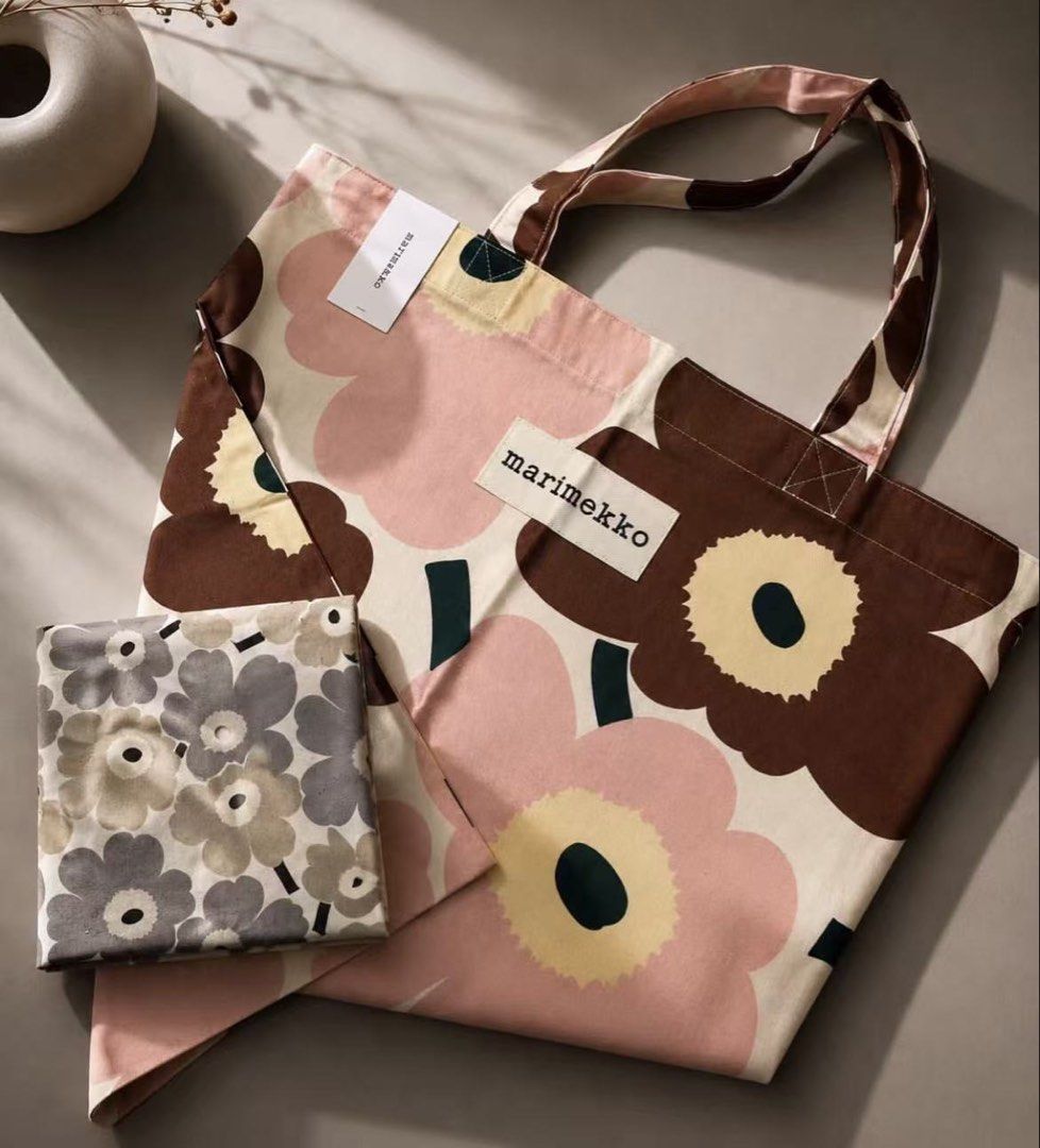 Marimekko Unikko Tote Bag (Category: Tote Bags) located in Makati City. Submitted by ciriacoria (Listing ID 1463332725, Image 1). Description: - Iconic Marimekko Unikko pattern tote bag - Features classic pink and brown flower print - Handles are also printed - Comes with a matching smaller pouch - Durable canvas material - Ideal for everyday use or travel.