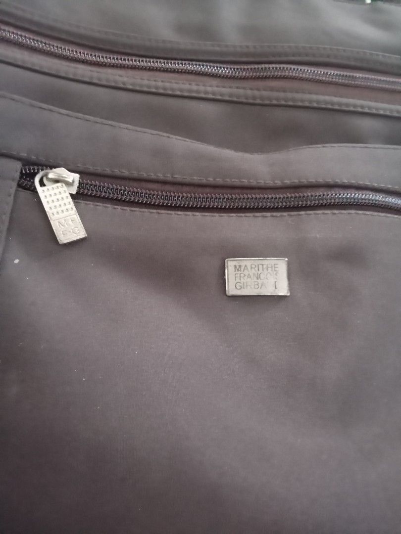 Marithe Francois Girbaud Tote Bag (Category: Tote Bags) located in Caloocan City. Submitted by noy5o1a (Listing ID 1463365800, Image 3). Description: - Dark brown Marithe Francois Girbaud tote bag - Main zippered compartment - Front zippered pocket - Smaller front pocket with magnetic closure - Comfortable strap length for carrying - Made of durable material - Plenty of space inside for essentials.