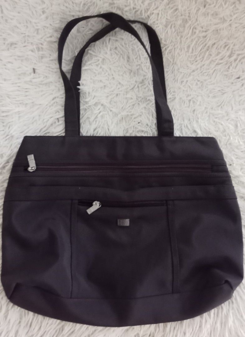 Marithe Francois Girbaud Tote Bag (Category: Tote Bags) located in Caloocan City. Submitted by noy5o1a (Listing ID 1463365800, Image 1). Description: - Dark brown Marithe Francois Girbaud tote bag - Main zippered compartment - Front zippered pocket - Smaller front pocket with magnetic closure - Comfortable strap length for carrying - Made of durable material - Plenty of space inside for essentials.