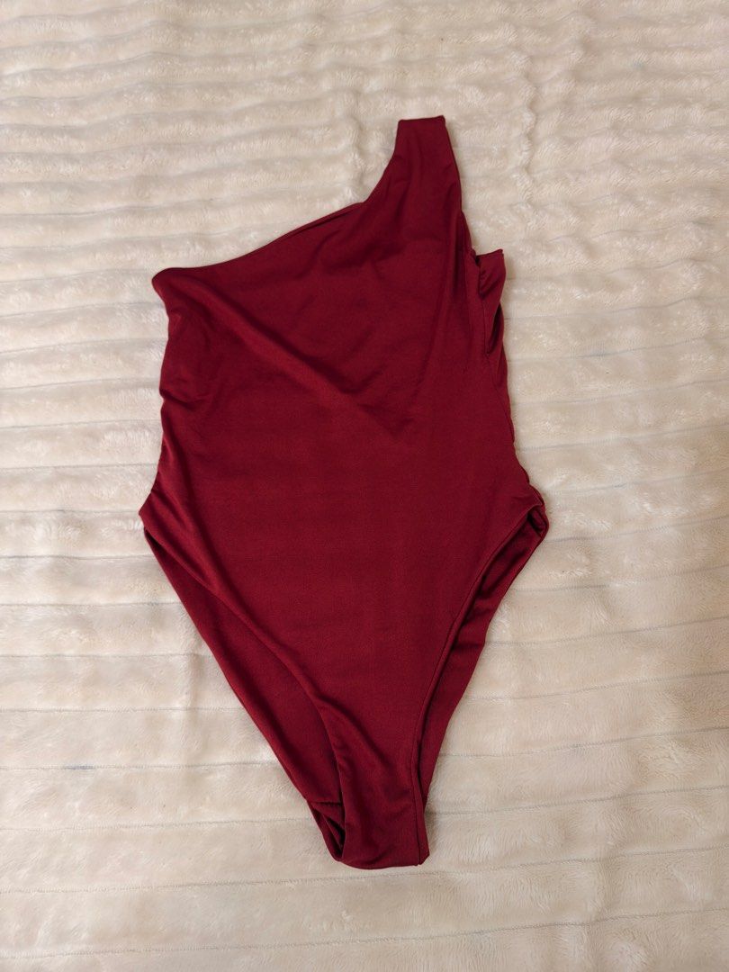 Maroon One-Shoulder Bodysuit (Category: Others Tops) located in Rizal. Submitted by rianaht (Listing ID 1463400487, Image 2). Description: Chic maroon one-shoulder bodysuit - Never used - Can fit XS to Small 🌸 RFS: Decluttering 🌸 Delivery only to be shouldered by the buyer. 🌸 Payment via GCash / Maya / Maribank.
