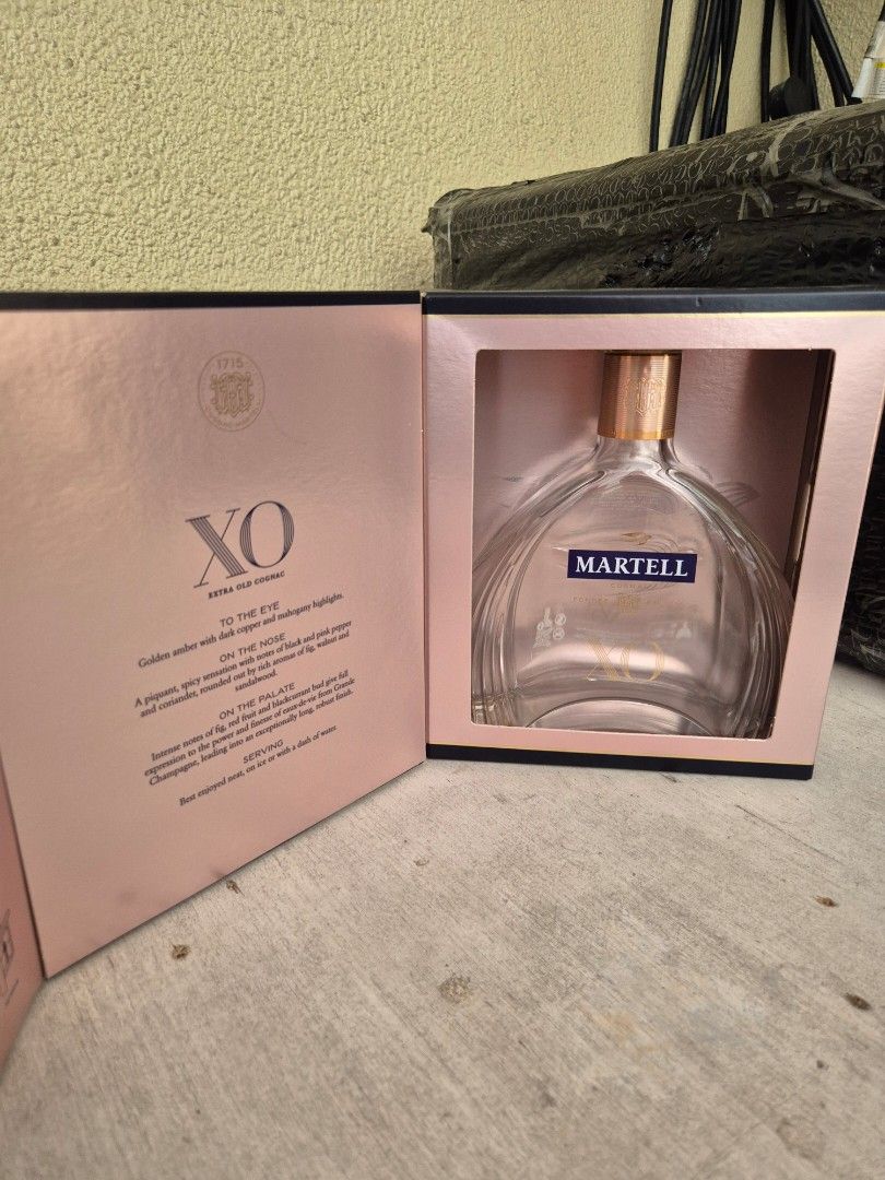 Martell XO Extra Old Cognac Empty Bottle with Box (Category: Beverages) located in Manila. Submitted by jayveecatu14021 (Listing ID 1463377427, Image 2). Description: Empty Martell XO cognac bottle. Comes with its original presentation box. The bottle has the distinctive XO shape. Box has some wear. Great for collectors or display. Selling as is..