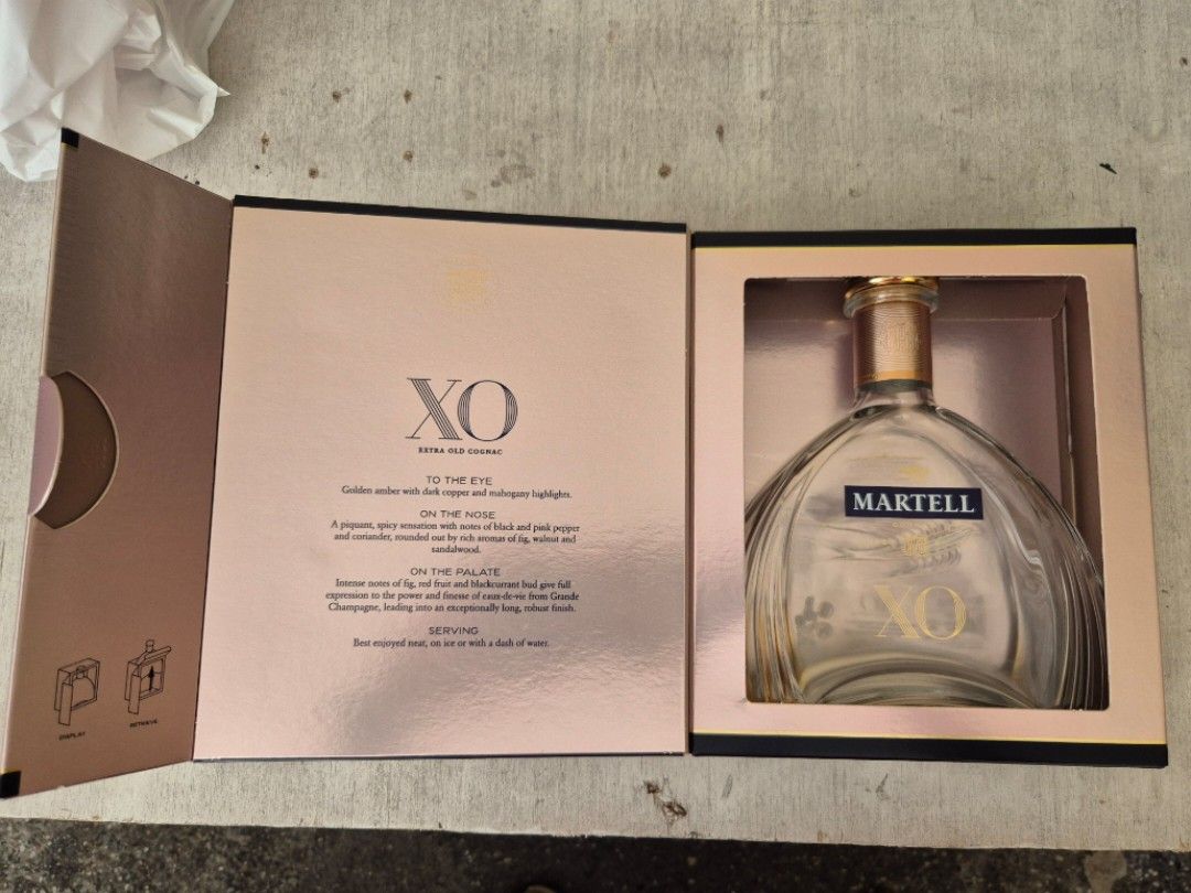 Martell XO Extra Old Cognac Empty Bottle with Box (Category: Beverages) located in Manila. Submitted by jayveecatu14021 (Listing ID 1463377427, Image 3). Description: Empty Martell XO cognac bottle. Comes with its original presentation box. The bottle has the distinctive XO shape. Box has some wear. Great for collectors or display. Selling as is..