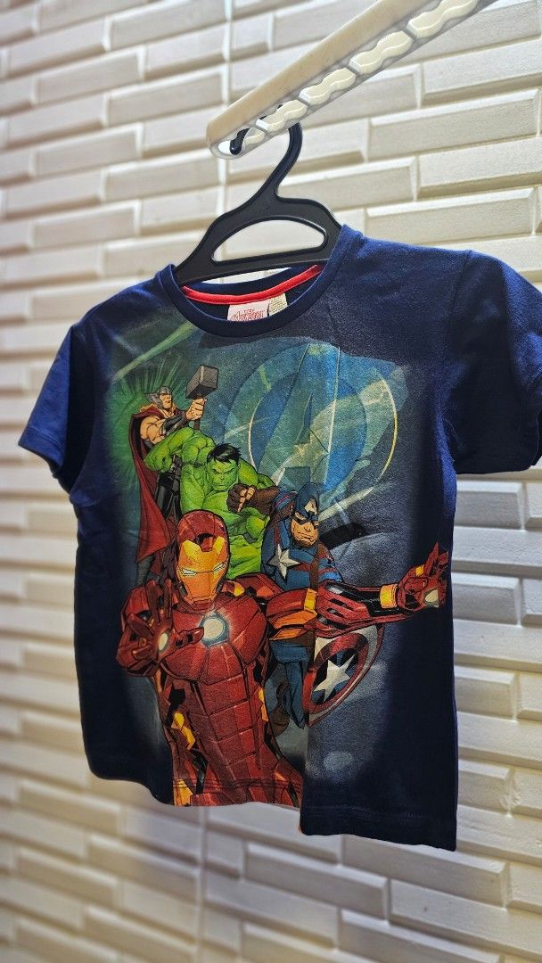Marvel Avengers T-shirt Size 10 (Category: Tshirts & Polo Shirts ) located in Quezon City. Submitted by dawnest (Listing ID 1463505466, Image 1). Description: - Navy blue t-shirt - Cool Marvel Avengers graphic print featuring Iron Man, Captain America, Thor, and Hulk - Small Marvel tag on the sleeve - Size 10 - Ideal for any young Avengers fan! -16 inches width, 20 inches length .