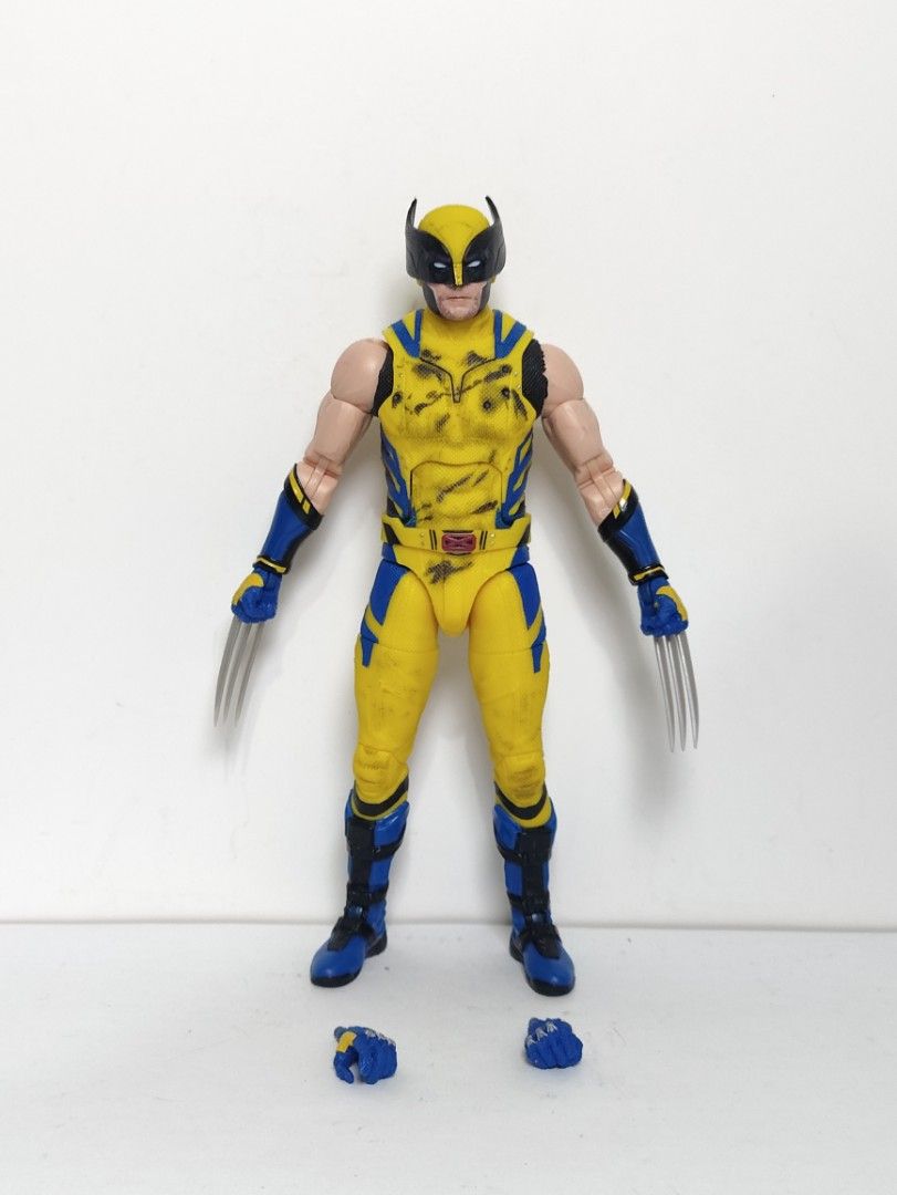 Marvel Legends Wolverine Action Figure with Claws and Extra Hands (Category: Figurines & Statues) located in Abucay. Submitted by lxtoyverse (Listing ID 1463471845, Image 1). Description: - Classic Wolverine action figure in yellow and blue costume. - Features retractable claws. - Includes two sets of interchangeable hands. - Highly poseable for dynamic display or play. - A must-have for any Marvel fan's collection..