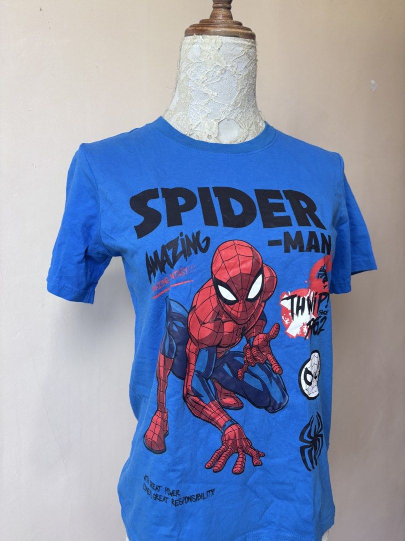 Marvel Spider-Man Blue Graphic T-Shirt (Category: Shirts) located in Manila. Submitted by galitsabarat (Listing ID 1463418330, Image 2). Description: SMALL TO MEDIUM WOMANS - Cool blue t-shirt - Big 'Amazing Spider-Man' graphic on front - Text: 'Thwip! Since 1962' - Small Marvel tag on the side - Plain blue back - Ideal for Spider-Man fans.