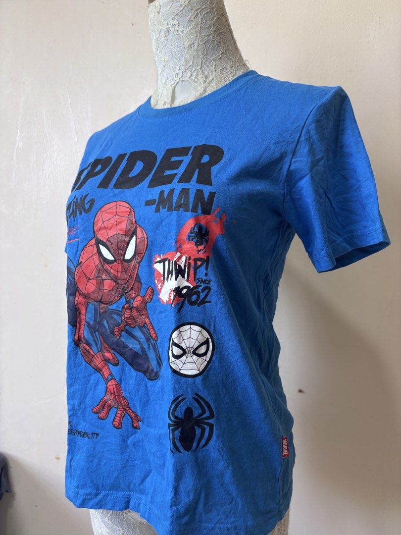 Marvel Spider-Man Blue Graphic T-Shirt (Category: Shirts) located in Manila. Submitted by galitsabarat (Listing ID 1463418330, Image 3). Description: SMALL TO MEDIUM WOMANS - Cool blue t-shirt - Big 'Amazing Spider-Man' graphic on front - Text: 'Thwip! Since 1962' - Small Marvel tag on the side - Plain blue back - Ideal for Spider-Man fans.