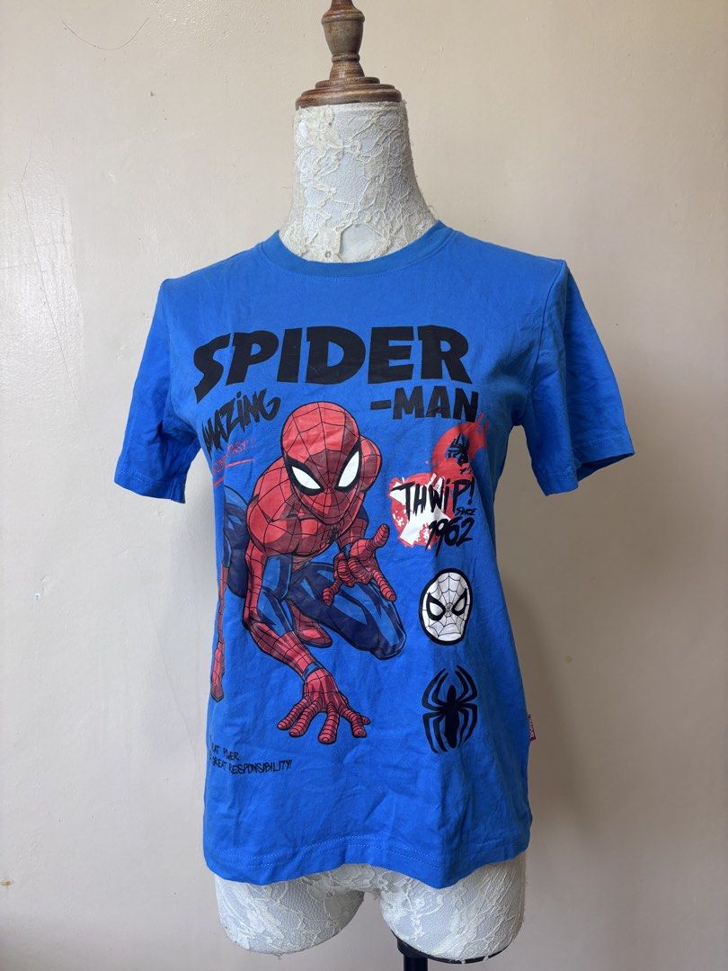 Marvel Spider-Man Blue Graphic T-Shirt (Category: Shirts) located in Manila. Submitted by galitsabarat (Listing ID 1463418330, Image 1). Description: SMALL TO MEDIUM WOMANS - Cool blue t-shirt - Big 'Amazing Spider-Man' graphic on front - Text: 'Thwip! Since 1962' - Small Marvel tag on the side - Plain blue back - Ideal for Spider-Man fans.