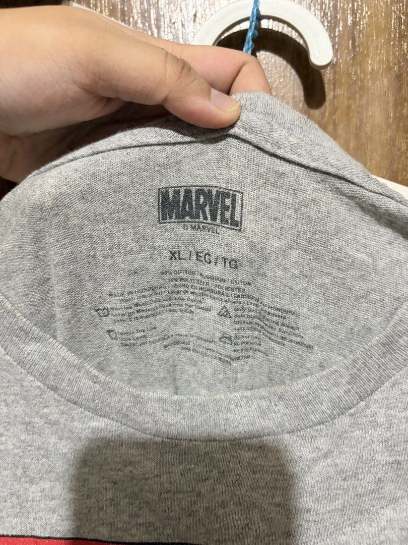 [MARVEL TEE] Marvel Comics Graphic T-Shirt XL (Category: Tshirts & Polo Shirts ) located in Imus. Submitted by frootiloots4103 (Listing ID 1463335179, Image 2). Description: - Grey Marvel Comics graphic tee - Features various Avengers characters print - Size: XL - Measurements: 22 inches wide x 32 inches long - Material: Cotton blend - Ideal for any Marvel fan OPEN FOR NEGO (best if aspack) 📍Imus, Cavite 4103 Can do meetups within Imus Area 🚚 J