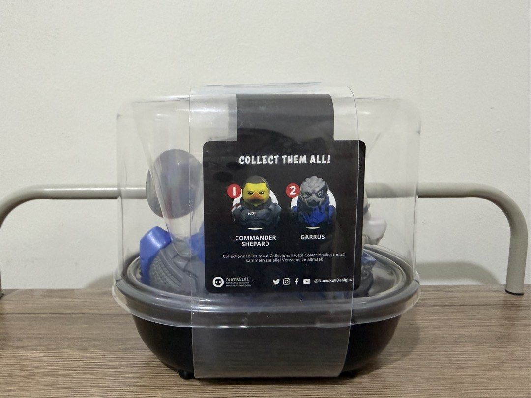 Mass Effect Tubbz Garrus "First Edition" Collectible (Category: Designer & Blind Box Toys) located in Magalang. Submitted by xeevain (Listing ID 1463403591, Image 3). Description: - Mass Effect Tubbz Collectible - Character: Garrus Vakarian - Series: 2 - Edition: First Edition - Condition: Comes in original clear display case - Ideal for Mass Effect fans and collectors - Packaging shows it's part of a larger collection -Never opened, stocked only