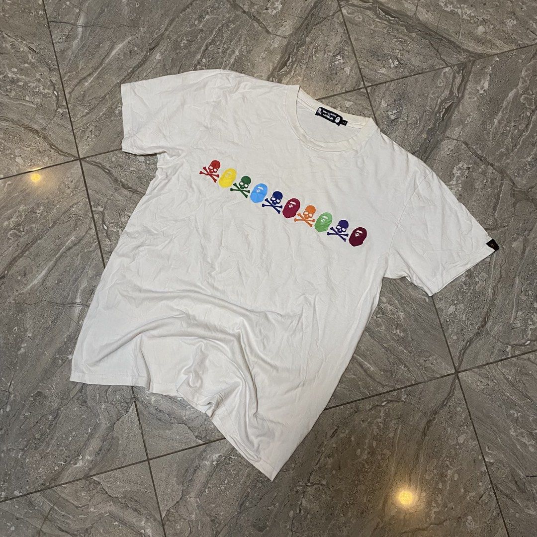 Mastermind Japan x A Bathing Ape Rainbow Skull Tee (Category: Tshirts & Polo Shirts ) located in Manila. Submitted by _vnnnsss (Listing ID 1463488965, Image 1). Description: - Mastermind Japan x A Bathing Ape collaboration tee - Features iconic rainbow skull and ape head graphic on the chest - "mastermind A BATHING APE" text in rainbow colors on the back - Size: Large (L) - Perfect for collectors of rare streetwear.