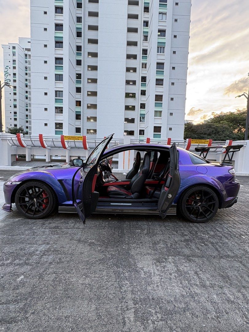 Mazda RX8 1.3 (A) (Category: Used Cars) located in Singapore. Submitted by lionelhowa (Listing ID 1463523592, Image 3). Description: Sadly have to let go for a family car Interiors: - Gearbox overhaul (June 2025) - Full radiator and wiring fix (Nov 2025) - Alignment & Suspension adjustments (April 2026) Exteriors: - Unique purple and blue chameleon paint (Copy GTR 😂) - Aftermarket widebody kit - Carbon fiber skirting - Carbon fiber hood - Carbon