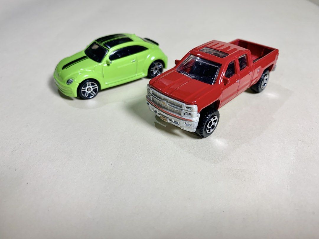 Mbx and Hotwheel 2x lot (Category: Vehicle & Diecast Models) located in Mandaue City. Submitted by maxguiller89260 (Listing ID 1463512115, Image 1). Description: 2 unit lot West Coast sourced thrift item shop 2014 Chevrolet Silverado 1500 double-cab pickup 1:64 standard MBX Explorers Cherry Red non chrome front variant (originally released as number 29/120) Thailand - [ ] Brand: Hot Wheels - [ ] Volkswagen Beetle - [ ] Lime green / black race str